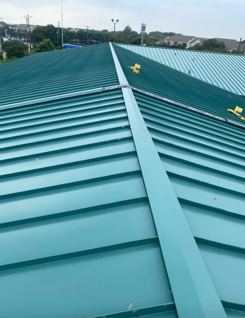 Green commercial metal roof ridge and valley for Metal Roof Repair in Port Isabel