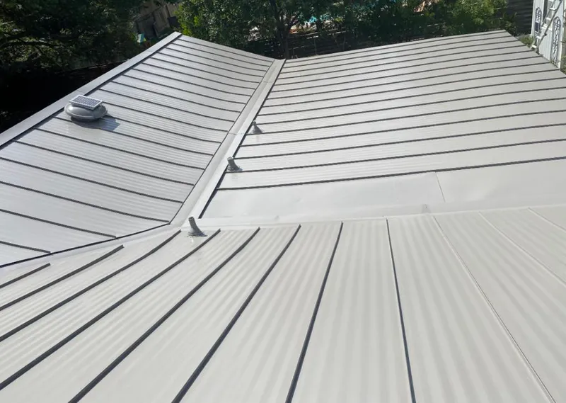 Solar attic fan installed on a metal roof for Roof Ventilation in Port Isabel